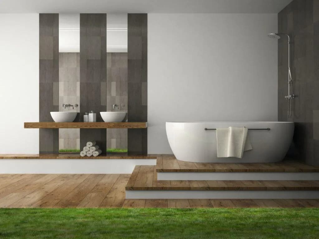 A bright freestanding bath with a garden view